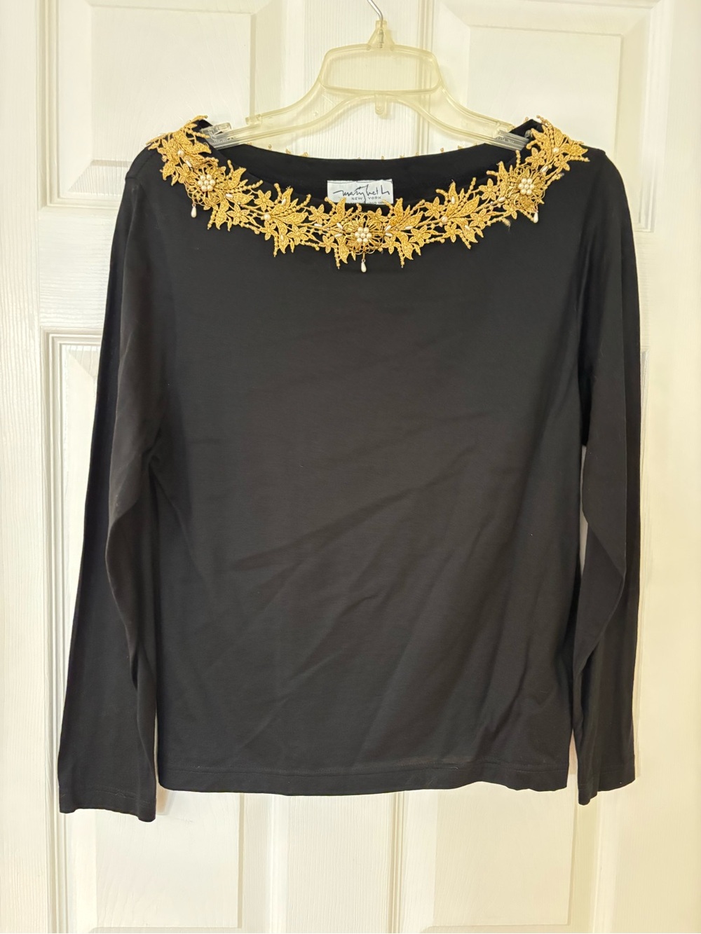 Womanโs Marybeth Black Long-Sleeve Top with Gold Floral Neck Embellishment Large